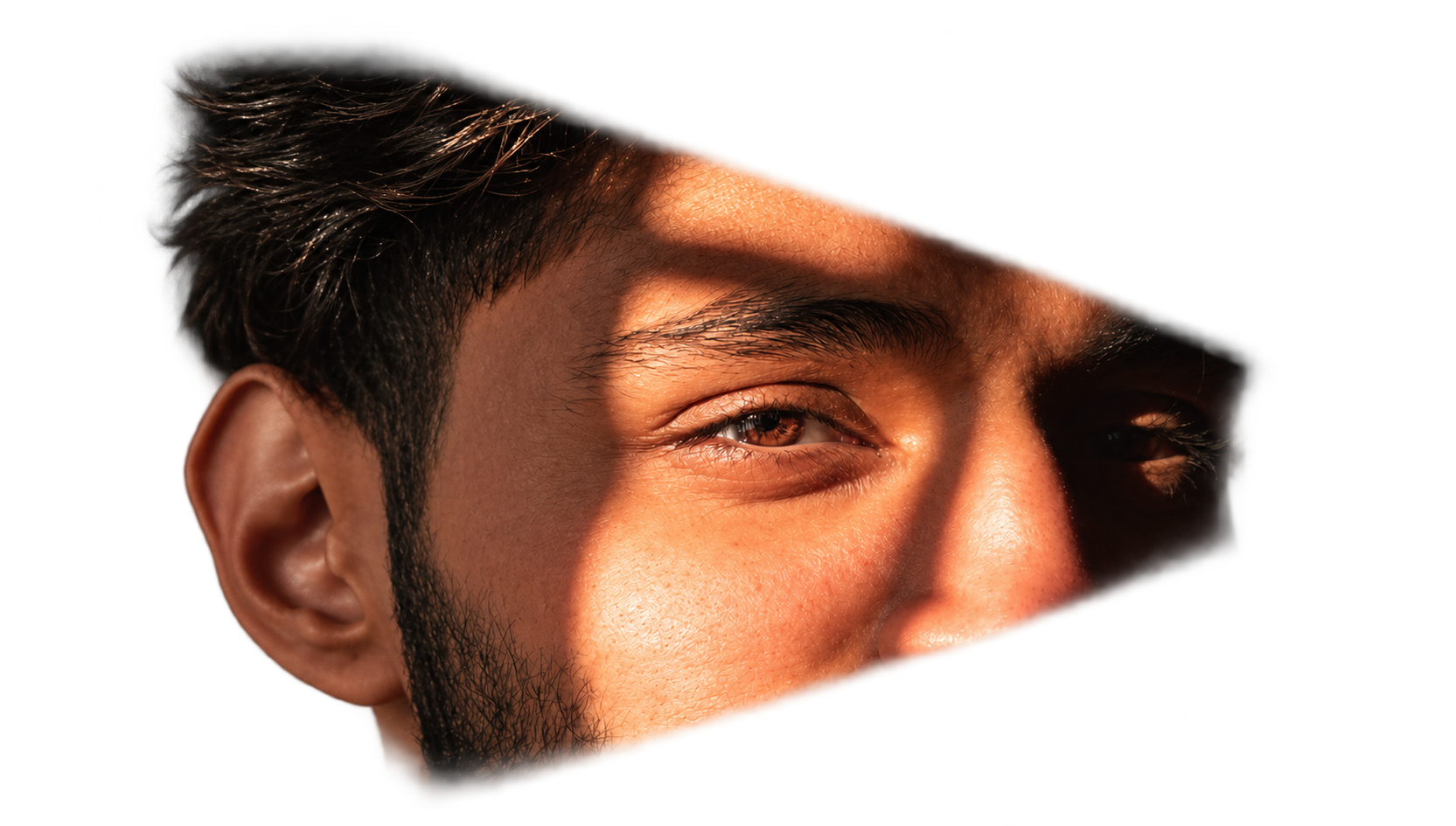 Close up of Mohit's eye lit by a warm beam of light